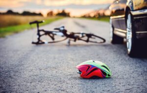 Bicycle and helmet on the road after accident