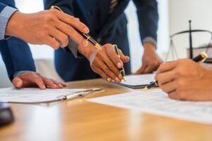 A team meeting of business people and a Mass Tort Lawyer