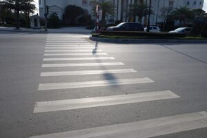 Crosswalk on the road representing the concept of Pedestrian Accident